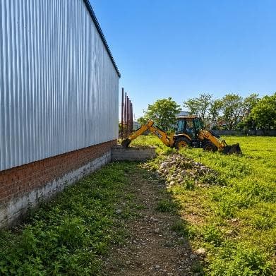 Shed side elevation with landscaping